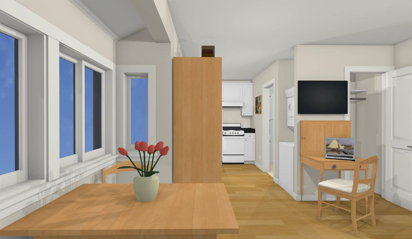 Looking from the kitchen nook towards kitchen in this tiny house